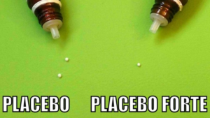 Image shows two globules at the laft (ironically marked as "placebo) and one globule at the right (ironically marked as "placebo forte".