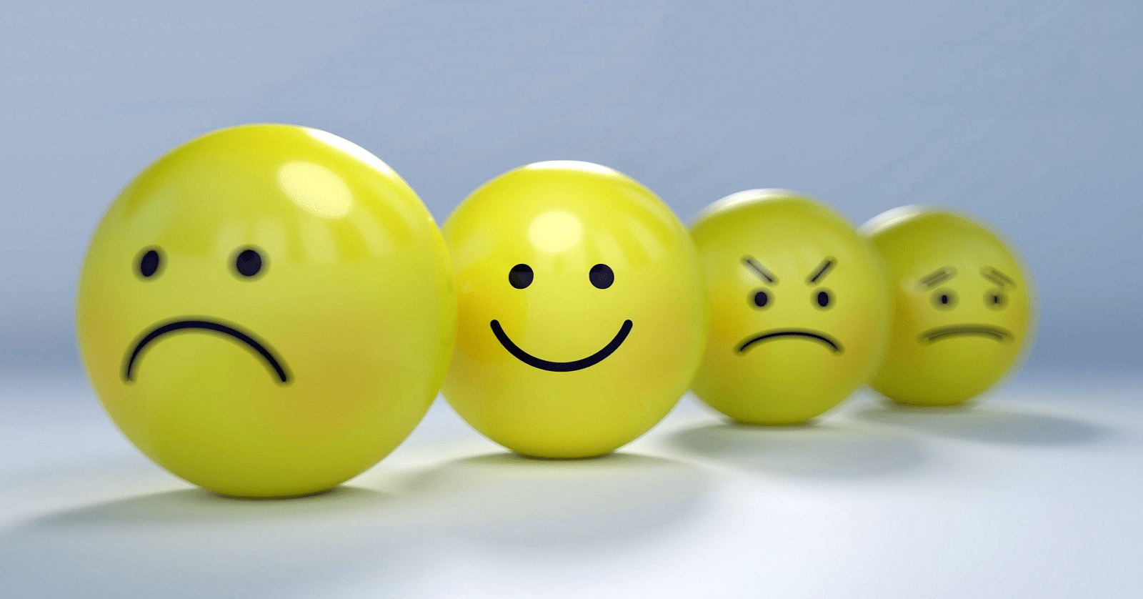 Four smileys - just one happily